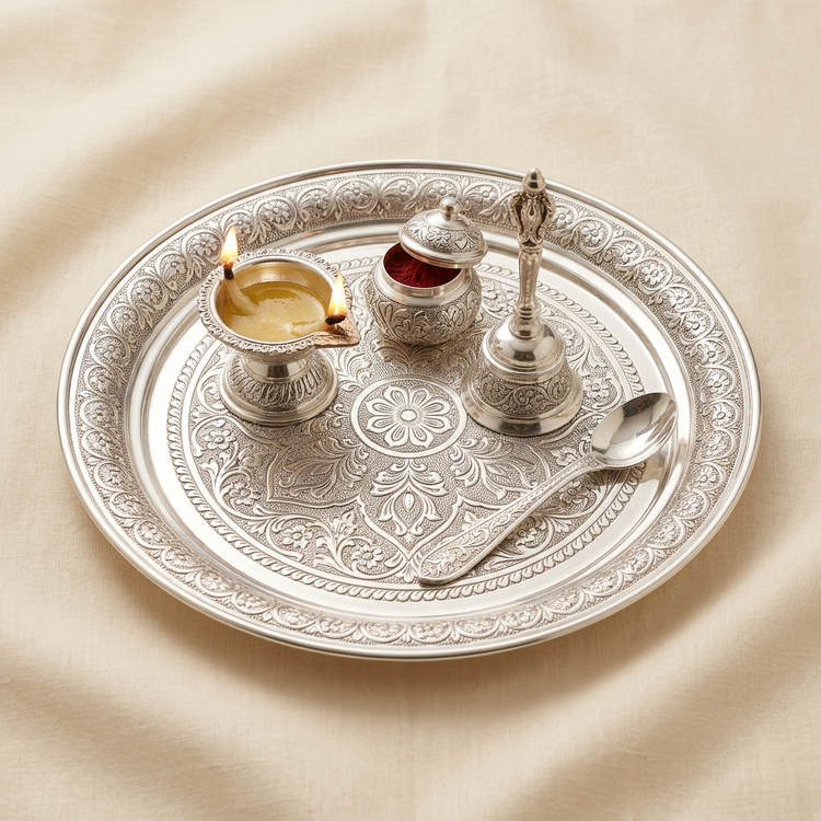 Silver pooja thali set with plate, diya, kumkum holder, bell and spoon